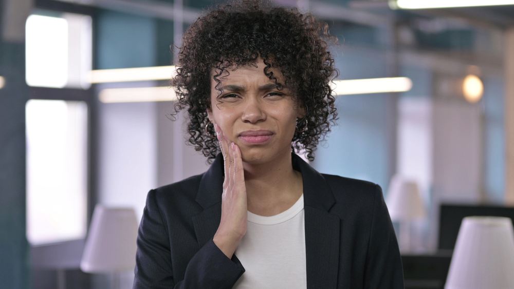 Portrait of Sick African Businesswoman having Toothache