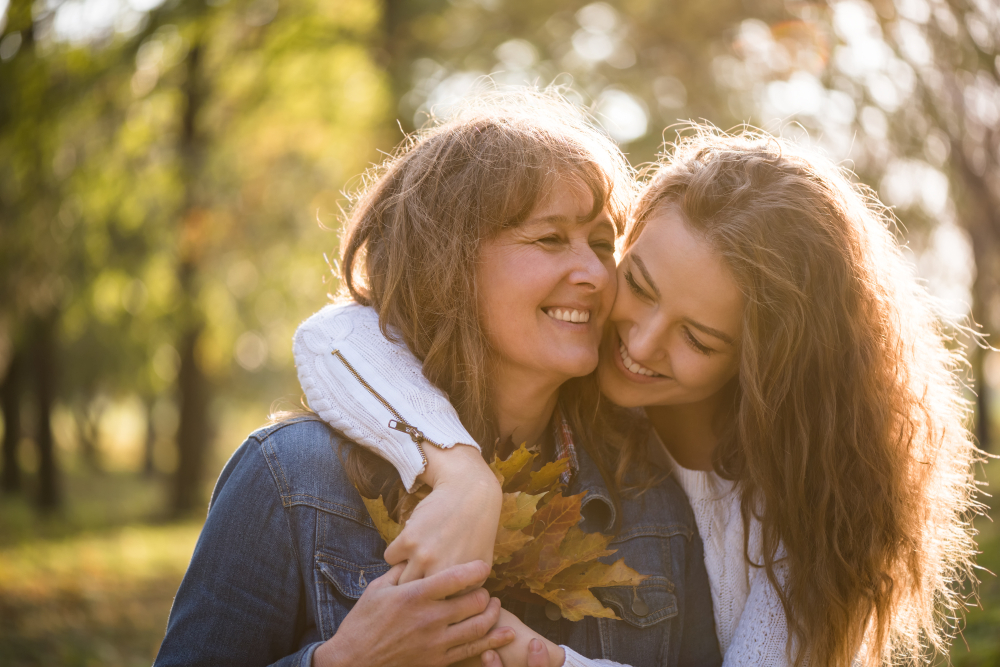 Tooth-Colored Inlay Fitting: Virginia Beach Restorative Dentistry Mother and Daughter Smiling Outdoors: Hampton Kecoughtan Dental Patients