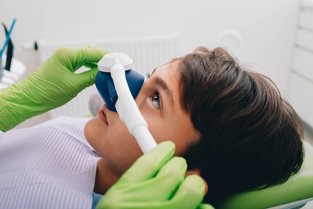 Young patient during sedation dentistry treatment in Hampton Child receiving sedation dentistry at our Hampton, VA office