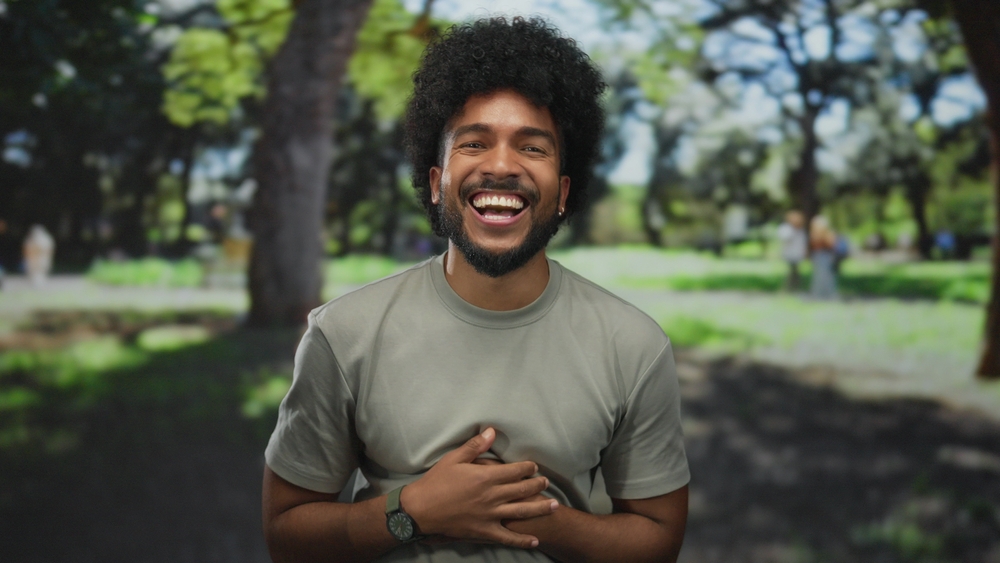 Man laughing outdoors in the Virginia Beach community 
