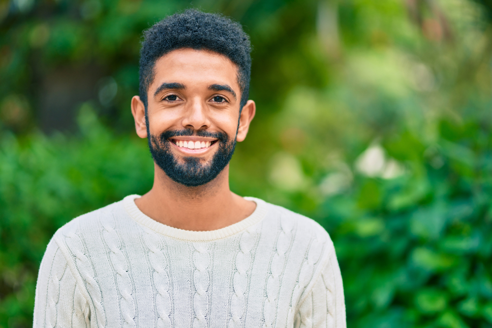Man with a healthy, bright smile outdoors in the Hampton Roads area 
