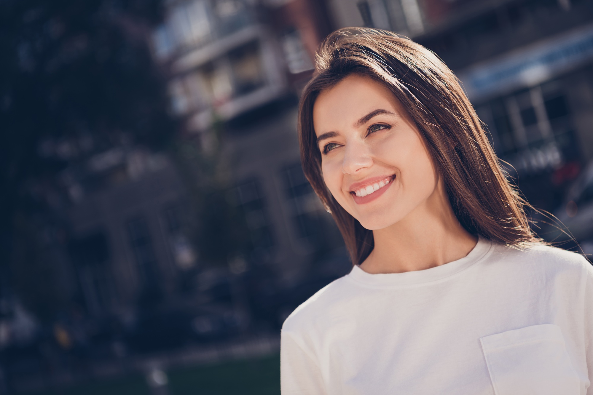 Woman with a bright smile outdoors in the Virginia Beach community 