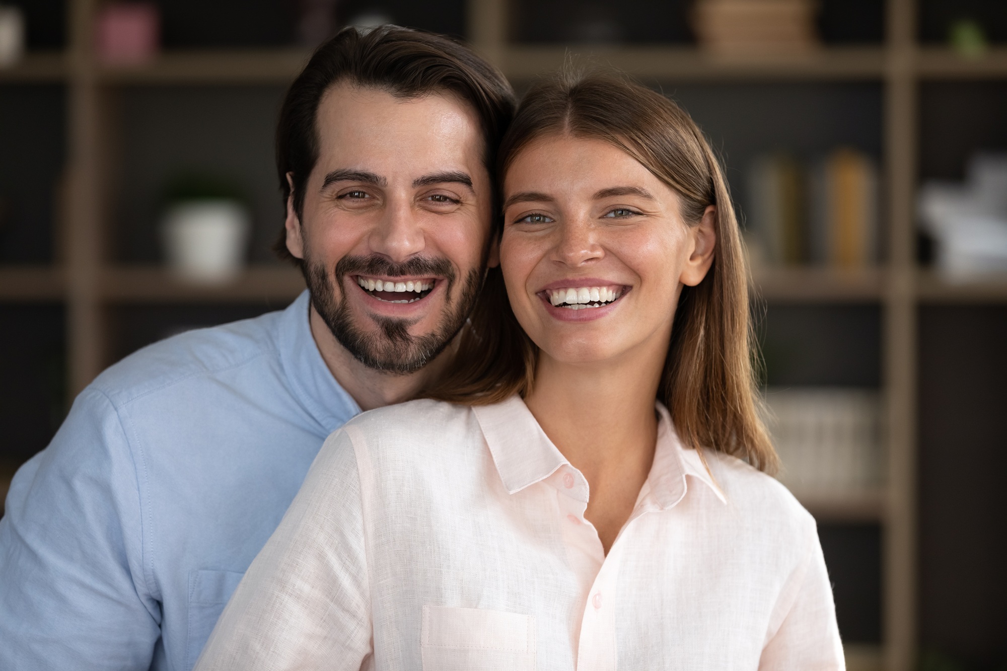Couple smiling together indoors in the Virginia Beach community 