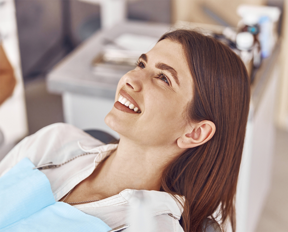 Patient smiling while reclined in the chair at our Virginia Beach, VA office 