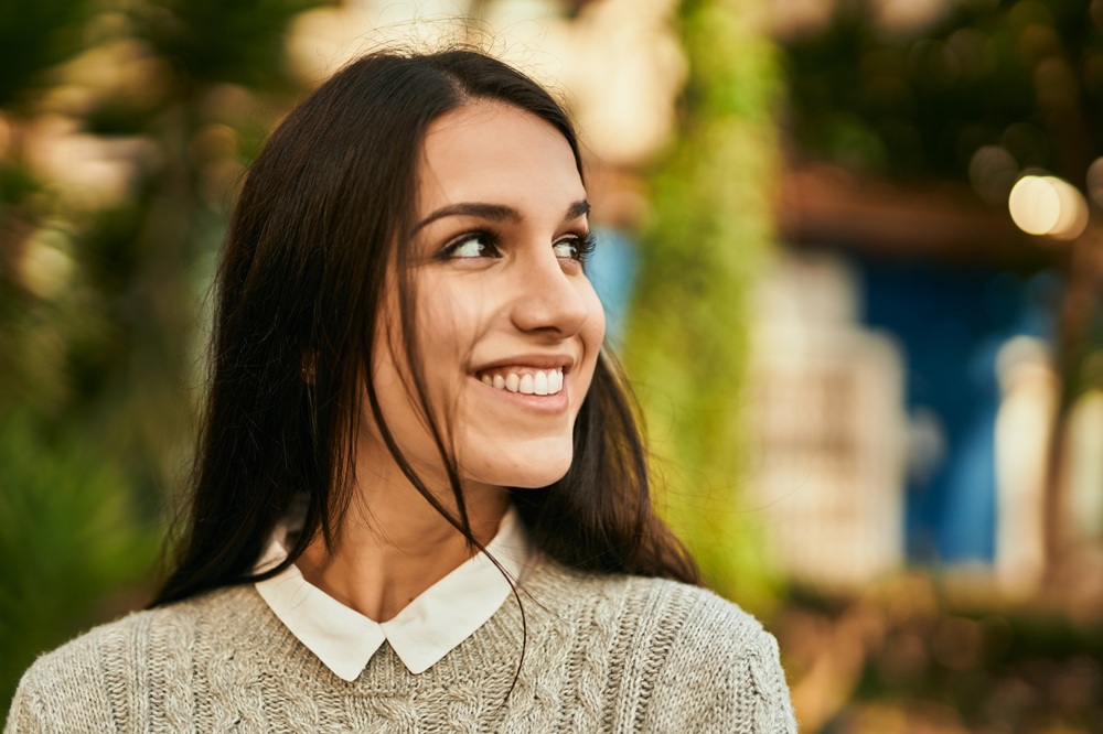 Woman with a healthy, bright smile outdoors in the Hampton community 