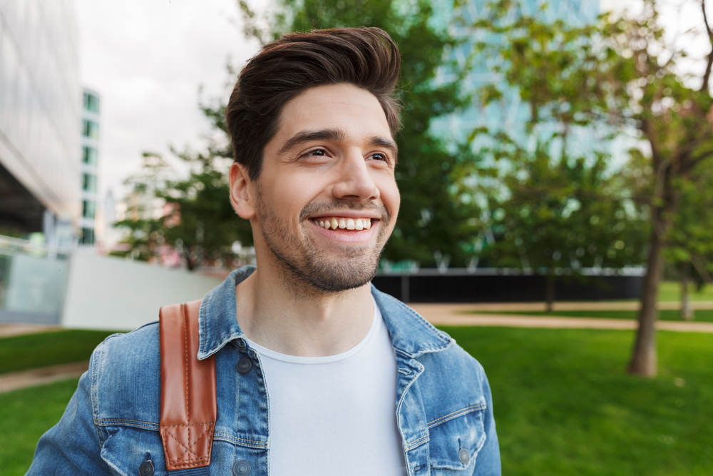 Man with a healthy smile outdoors in the Hampton Roads area 